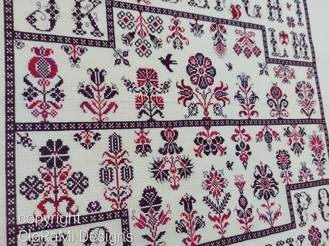 picture of the red cross-stitch sampler Ref 069 Blooming CloRaMi Sampler