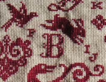 elegant cross stitch letters in needlepoint samplers