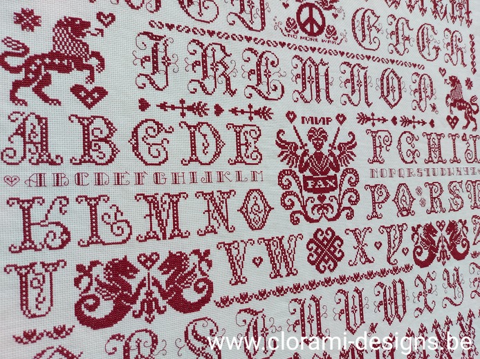 picture of the red cross stitch sampler Ref 070 Peace Sampler