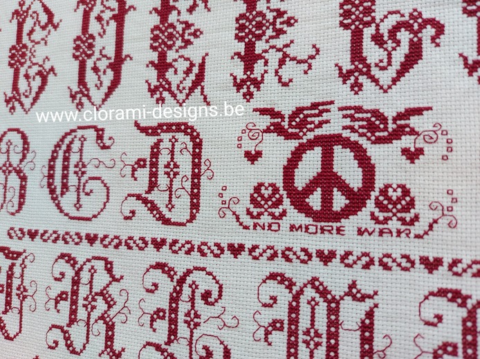 picture of the red cross stitch sampler Ref 070 Peace Sampler